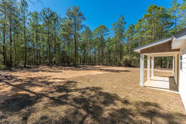 view of yard with a wooded view