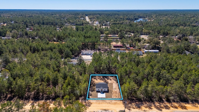 aerial view with a wooded view