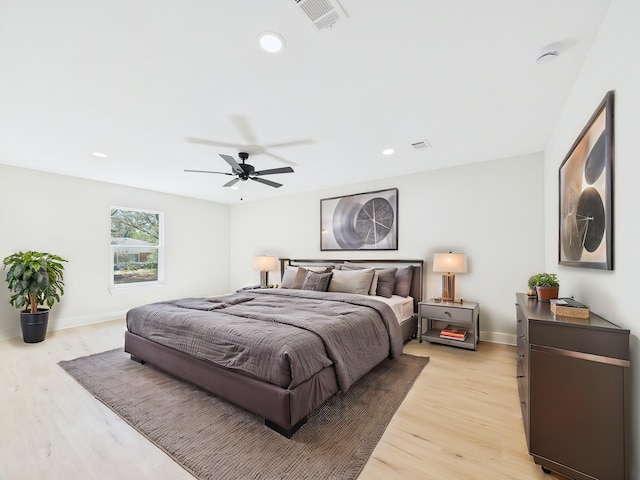 bedroom featuring visible vents, recessed lighting, light wood-type flooring, and baseboards