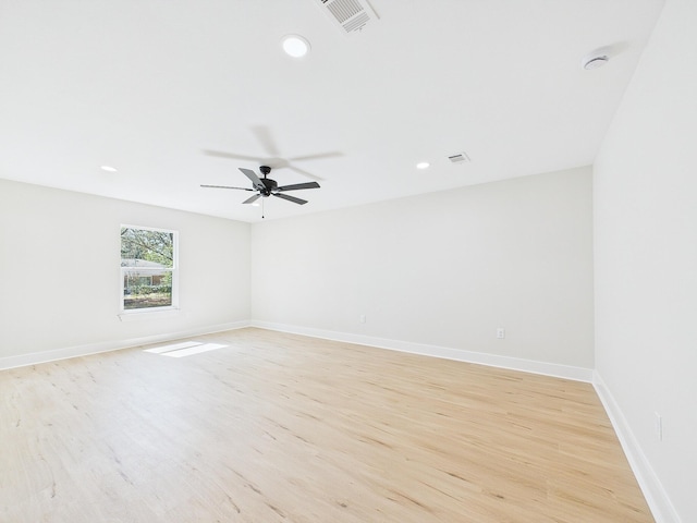 empty room with visible vents, baseboards, recessed lighting, light wood-style flooring, and a ceiling fan