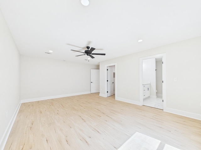 spare room with a ceiling fan, recessed lighting, baseboards, and light wood-type flooring