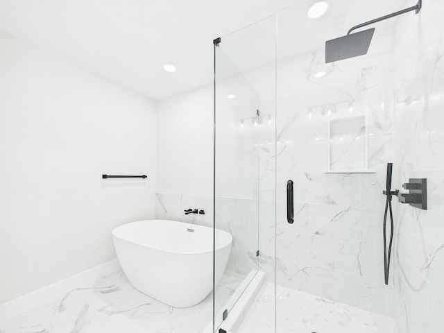 full bathroom featuring baseboards, a marble finish shower, a freestanding tub, recessed lighting, and marble finish floor