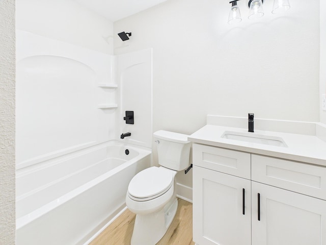 full bath with tub / shower combination, toilet, vanity, and wood finished floors