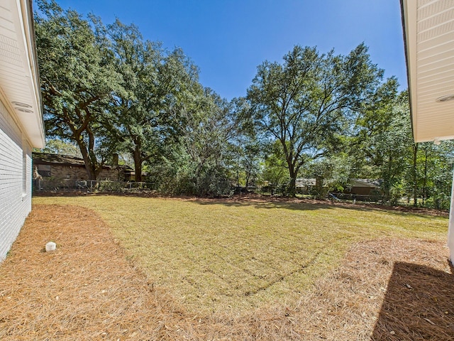 view of yard with fence