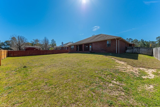 view of yard featuring a fenced backyard