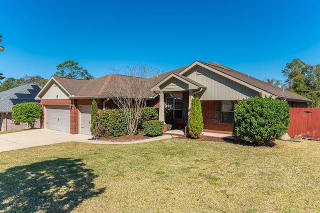 single story home featuring an attached garage, driveway, a front yard, and brick siding