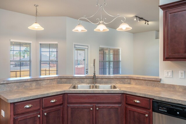 kitchen with decorative light fixtures, a sink, dishwasher, and dark brown cabinets