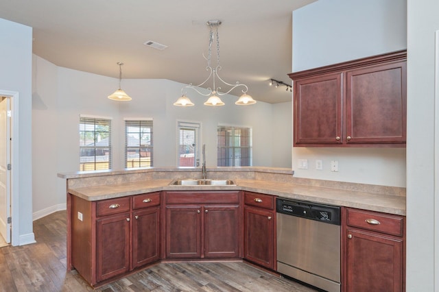 kitchen with light countertops, visible vents, a sink, and stainless steel dishwasher