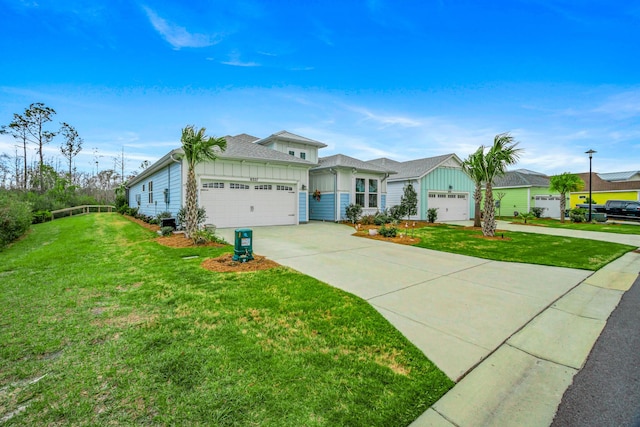 ranch-style home with board and batten siding, a front yard, driveway, and an attached garage