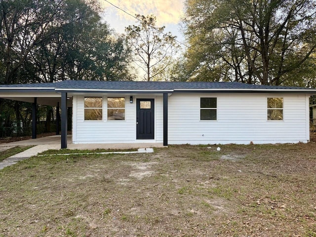 view of front facade featuring a carport