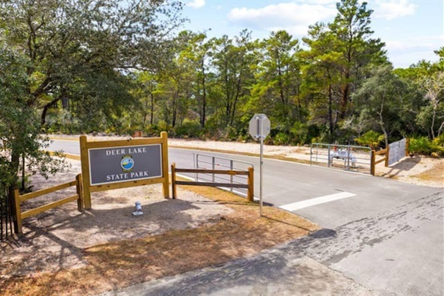 view of home's community with fence