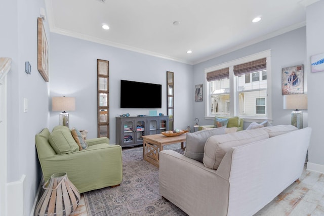 living area with recessed lighting, baseboards, and ornamental molding