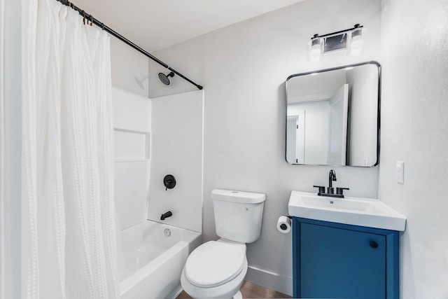 bathroom with toilet, shower / bath combo, baseboards, and vanity