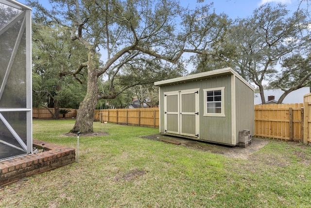 view of shed with a fenced backyard