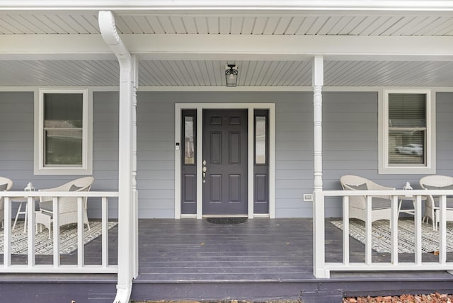 entrance to property featuring covered porch