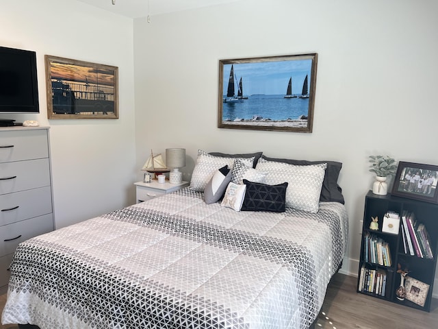 bedroom with wood finished floors