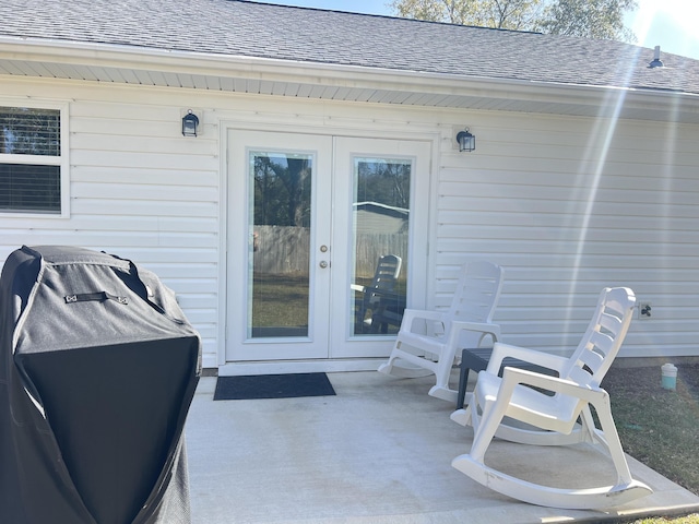 view of patio with french doors and a grill