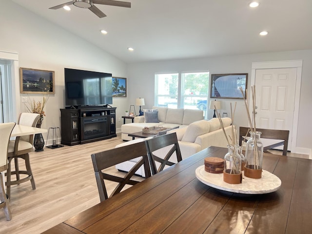 dining room with lofted ceiling, light wood finished floors, a ceiling fan, and recessed lighting