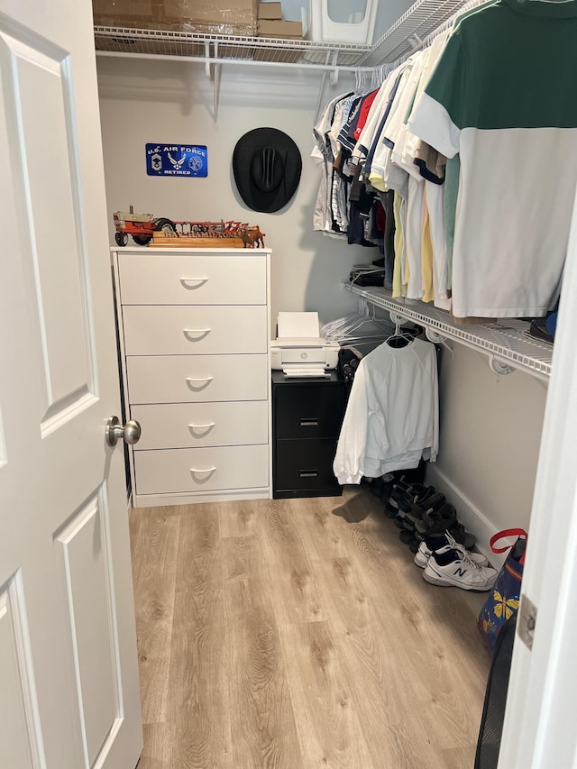 spacious closet with wood finished floors