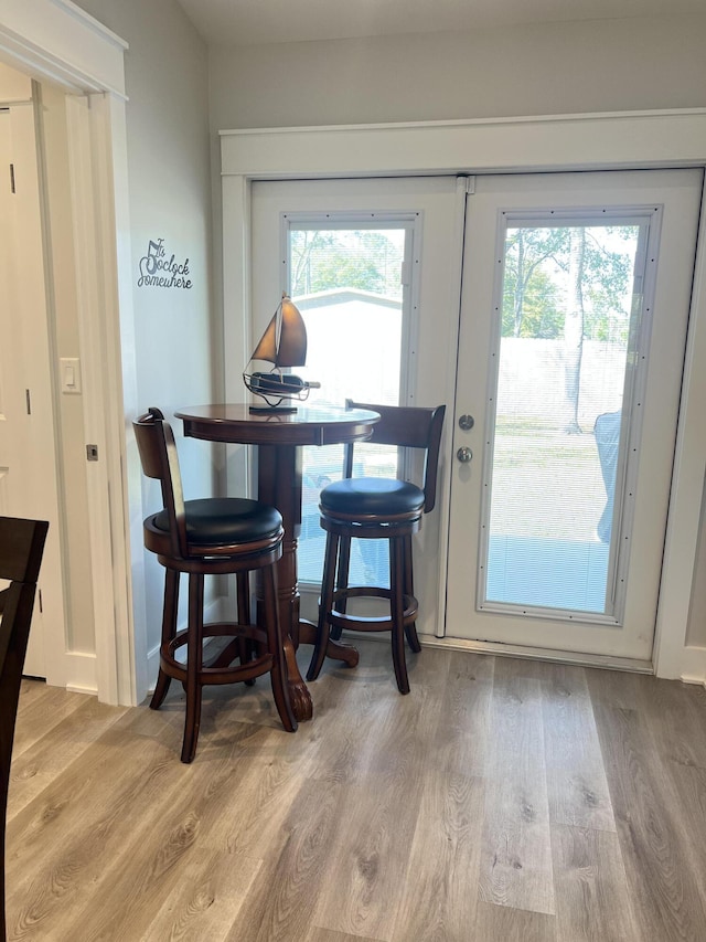 dining space featuring a wealth of natural light and wood finished floors