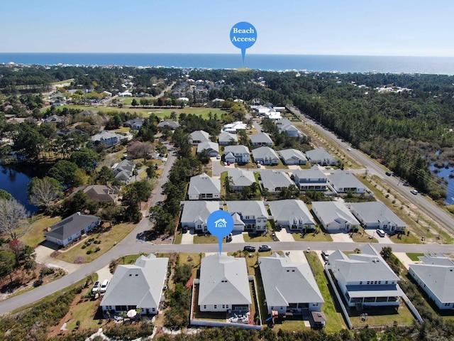 bird's eye view with a residential view and a water view