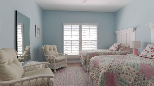 bedroom with a ceiling fan and wood finished floors