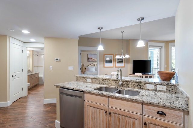 kitchen with a sink, light brown cabinets, light stone countertops, dark wood-style floors, and stainless steel dishwasher