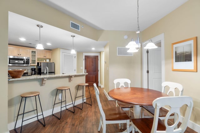 dining room featuring recessed lighting, visible vents, and dark wood-style flooring