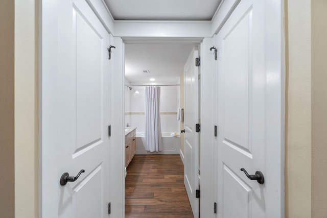 hallway with dark wood-style flooring