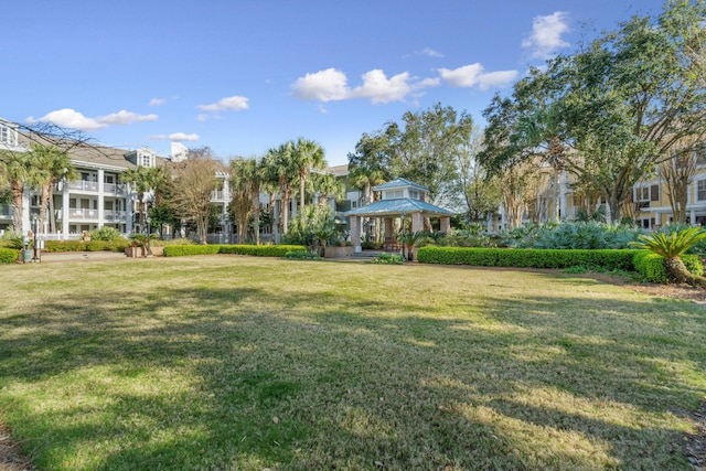 view of yard with a gazebo and a residential view