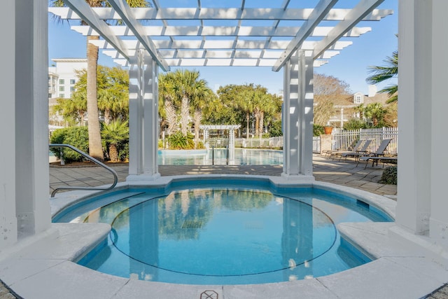 view of pool with fence, a pergola, and a hot tub