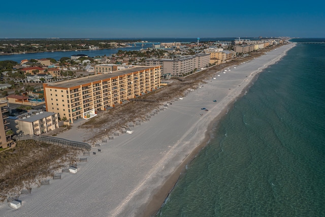 bird's eye view featuring a view of city, a water view, and a beach view