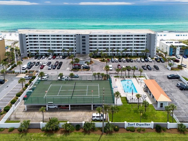 bird's eye view featuring a water view and a beach view