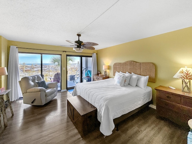 bedroom featuring hardwood / wood-style flooring, access to outside, a ceiling fan, and a textured ceiling