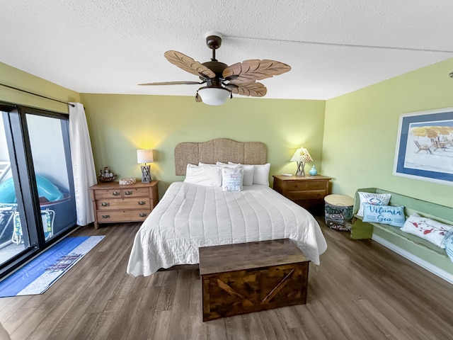 bedroom with ceiling fan, a textured ceiling, and wood finished floors