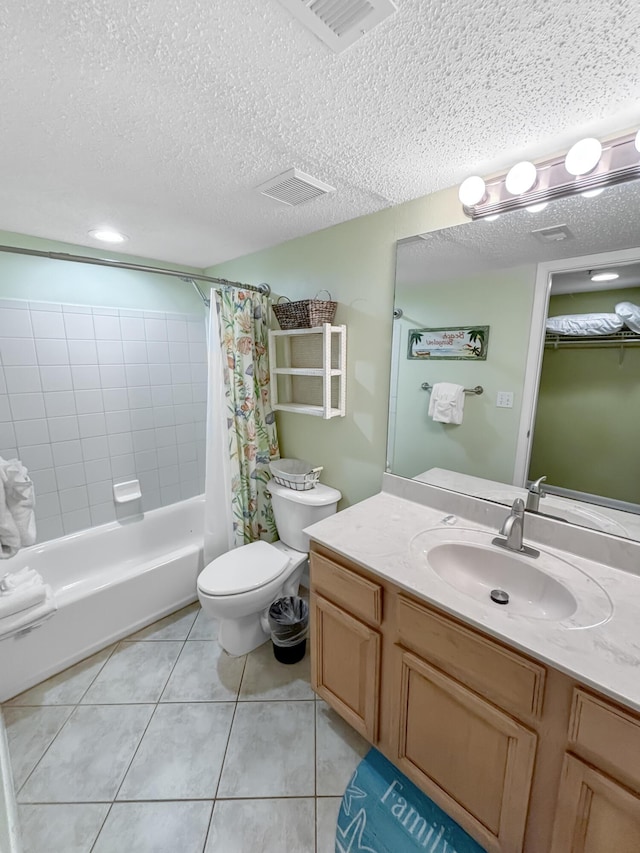 bathroom with visible vents, a textured ceiling, toilet, and tile patterned floors