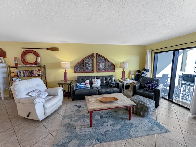 living area with a textured ceiling and tile patterned flooring