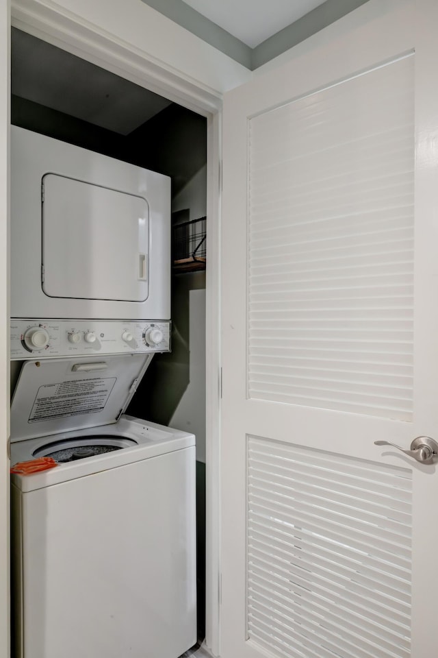 laundry area with laundry area and stacked washer and dryer