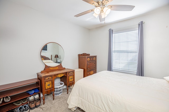 bedroom with a ceiling fan and carpet flooring