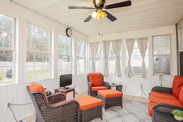 sunroom featuring cooling unit and a ceiling fan