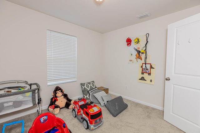 rec room featuring baseboards, visible vents, and carpet flooring