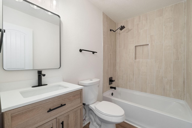 bathroom featuring toilet, shower / bathtub combination, a textured ceiling, and vanity