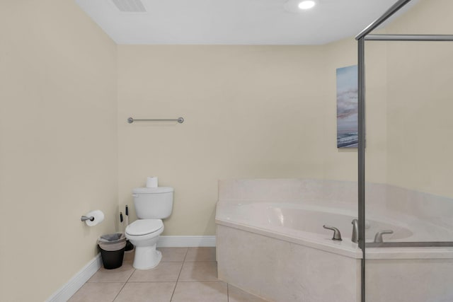 bathroom with baseboards, visible vents, toilet, tile patterned floors, and a bath