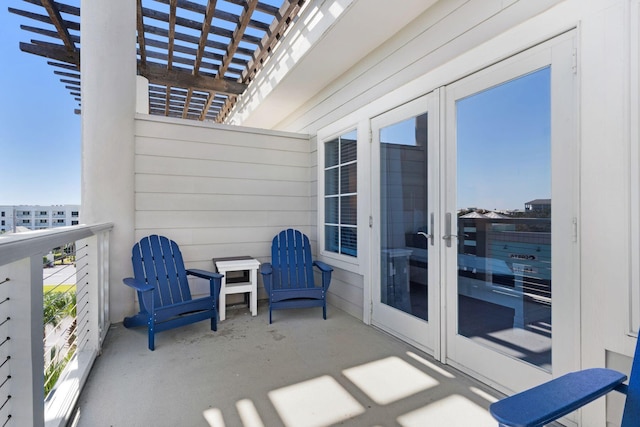 balcony featuring a pergola