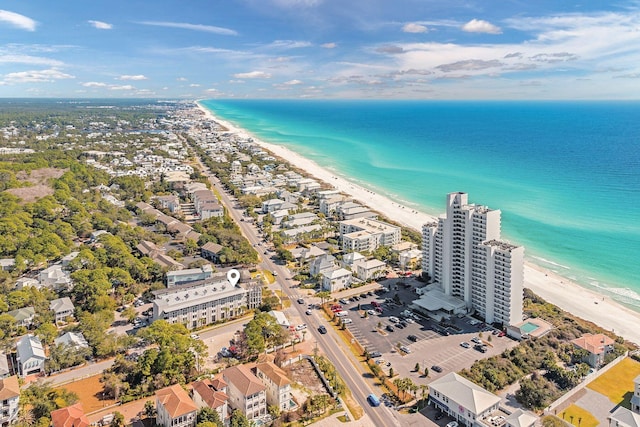 drone / aerial view with a water view and a beach view