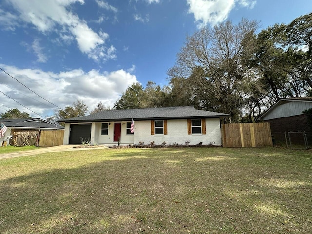 ranch-style house featuring a front yard, fence, driveway, a garage, and brick siding