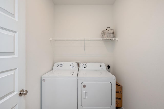 laundry room with laundry area and washer and clothes dryer