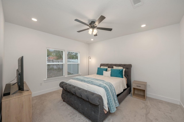 bedroom with light carpet, visible vents, baseboards, and recessed lighting