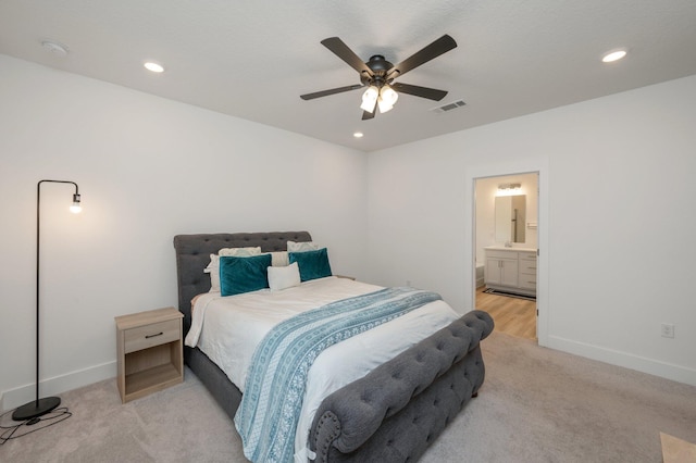 bedroom featuring recessed lighting, visible vents, baseboards, and light colored carpet