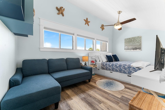 bedroom featuring a ceiling fan, lofted ceiling, wooden ceiling, and wood finished floors